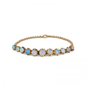 Art Deco Yellow Gold fine Opal Cabochon bracelet with multi-hinged floral setting adorned with vibrant Opals c1920.