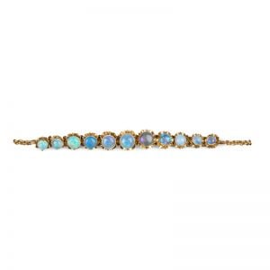 Art Deco Yellow Gold fine Opal Cabochon bracelet with multi-hinged floral setting adorned with vibrant Opals c1920.